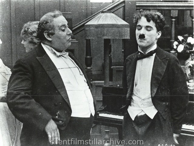 Henry Bergman and Charlie Chaplin in THE ADVENTURER (1917).
