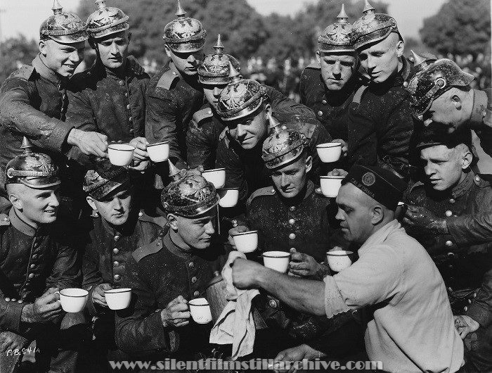 Lew Ayres and William Bakewell drink coffee in a publicity photo for ALL QUIET ON THE WESTERN FRONT (1931)
