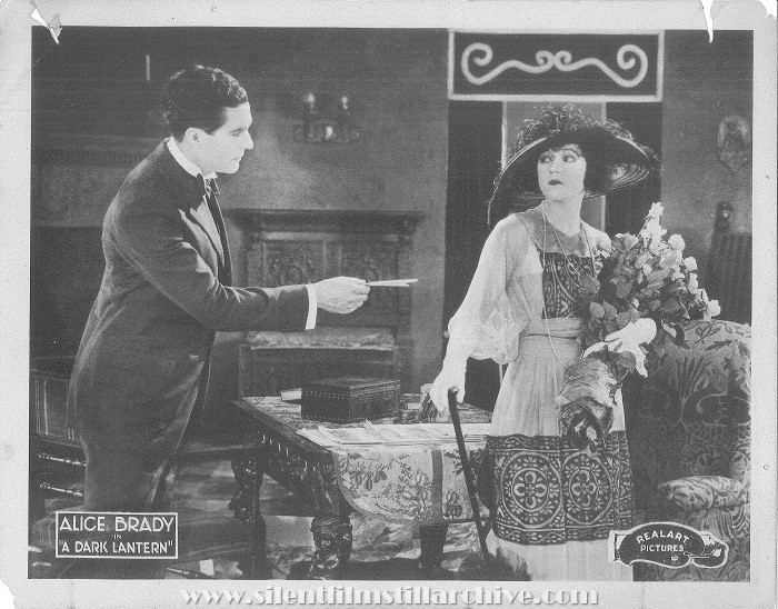 Lobby card for A DARK LANTERN (1920) with Alice Brady and James Crane