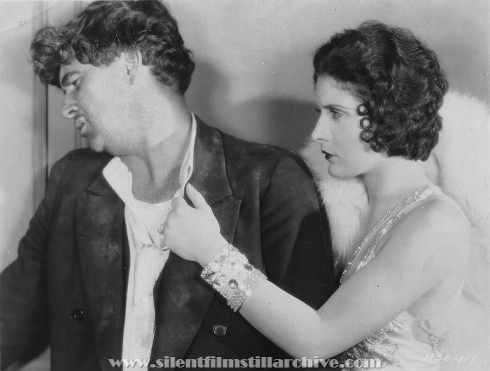 George Bancroft and Evelyn Brent in THE DRAG NET (1928)