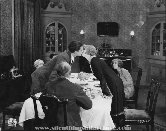 Gertrude Claire, Edward Peil Jr. kissing Esther Ralston, and Constance Bennett in THE GOOSE HANGS HIGH (1925)