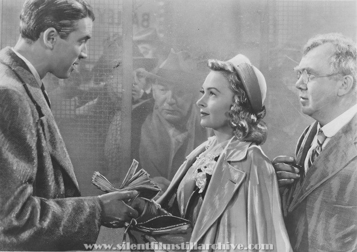 James Stewart, Donna Reed, and Thomas Mitchell in IT'S A WONDERFUL LIFE (1946)