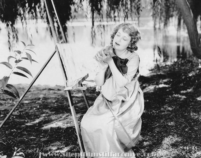 Marguerite Clark with a duck in LUCK IN PAWN (1919)