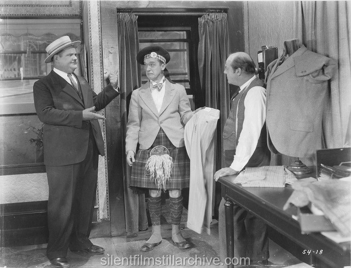 Oliver Hardy, Stan Laurel and Harvey Clark in PUTTING PANTS ON PHILIP (1927)