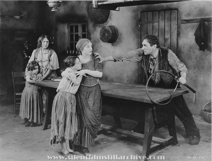 Rosita Marstini, Enid Bennett, and Mitchell Lewis in THE RED LILY (1924).