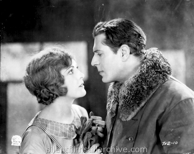 Billie Dove and Warner Baxter in THE AIR MAIL (1925)