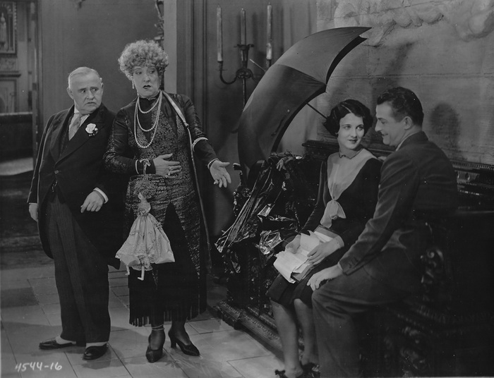 Otis Harlan, Emily Fitzroy, Gertrude Olmstead and Reginald Denny in THE CHEERFUL FRAUD (1926)