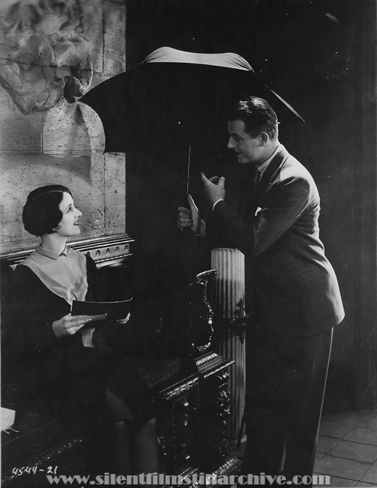 Gertrude Olmstead and Reginald Denny in THE CHEERFUL FRAUD (1926)