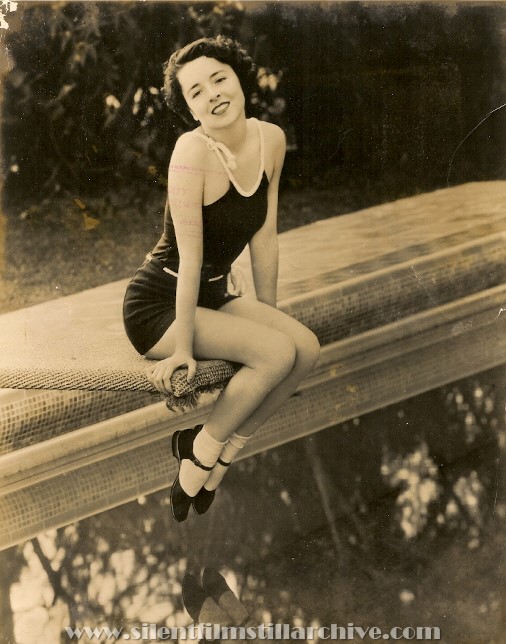 Press photo of Colleen Moore at her pool in 1934.