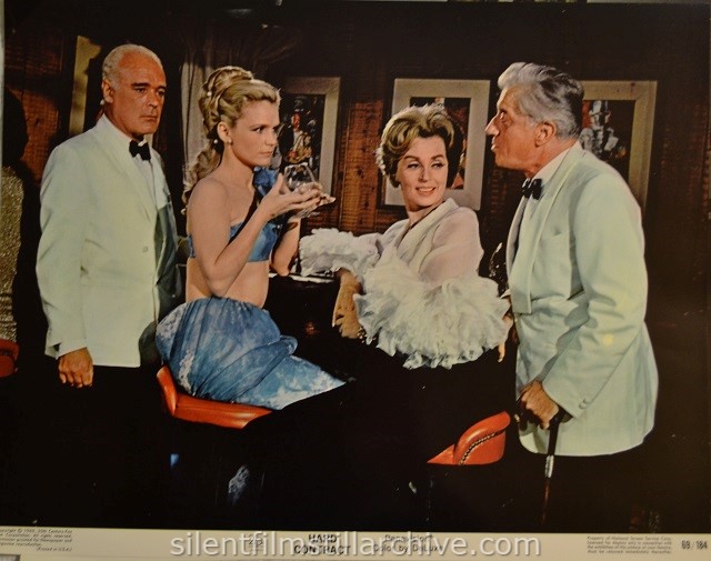 Lobby card with Patrick Mcgee, Lee Remick and Helen Cherry in HARD CONTRACT (1969)