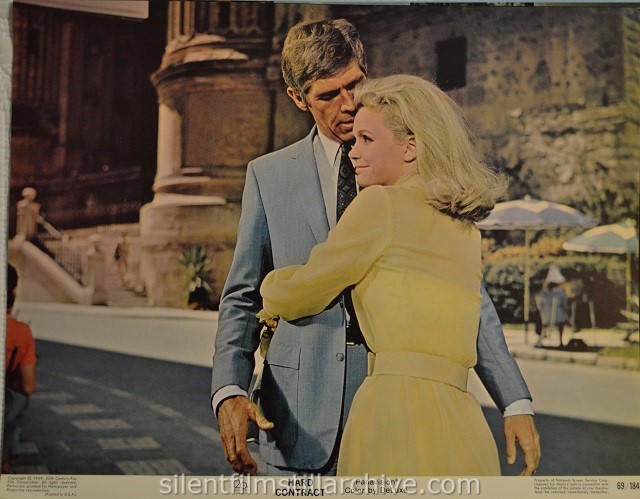 Lobby card with James Coburn and Lee Remick in HARD CONTRACT (1969)