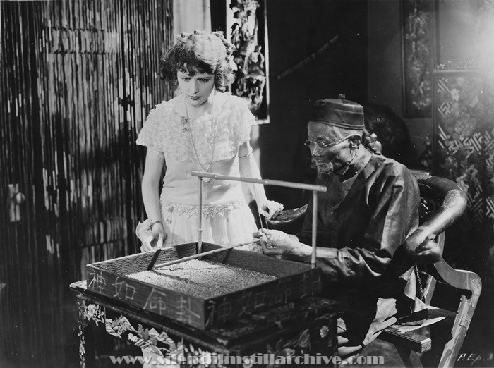 Edna Murpy and Fong Hong in HER DANGEROUS PATH (1923)
