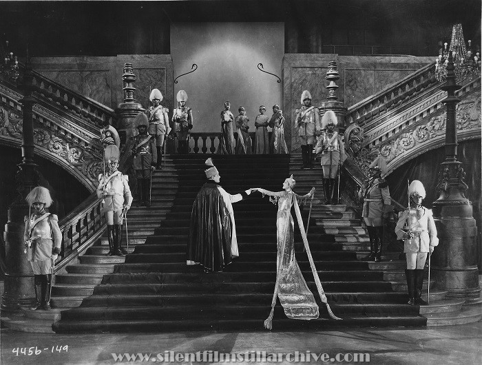 Francis X. Bushman and Billie Dove on a magnificent staircase  in THE MARRIAGE CLAUSE (1926).