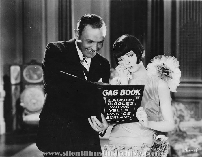 Director Millard Webb and Colleen Moore in a publicity pose for NAUGHTY BUT NICE (1927)