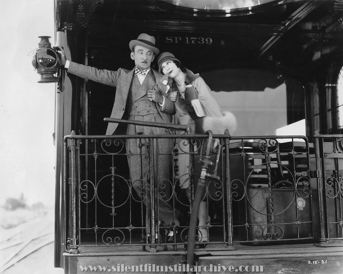 Jerry Drew and Jacqueline Logan on a train's observation platform in POWER (1928)