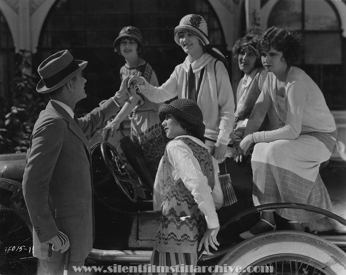 Hallam Cooley and Laura La Plante in SPORTING YOUTH (1924)