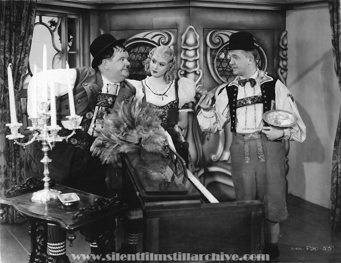 Oliver Hardy, Della Lind (Grete Natzler), and Stan Laurel in SWISS MISS (1938)