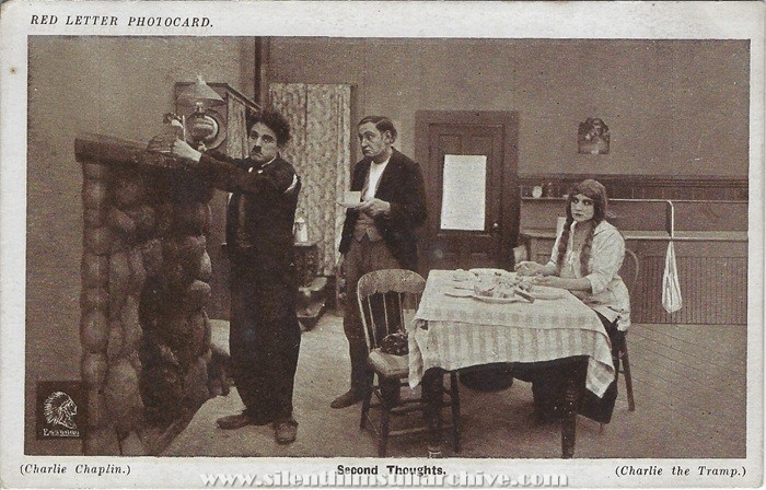 Red Letter Photocard of Charlie Chaplin, Ernest VanPelt and Edna Purviance in THE TRAMP (1915)